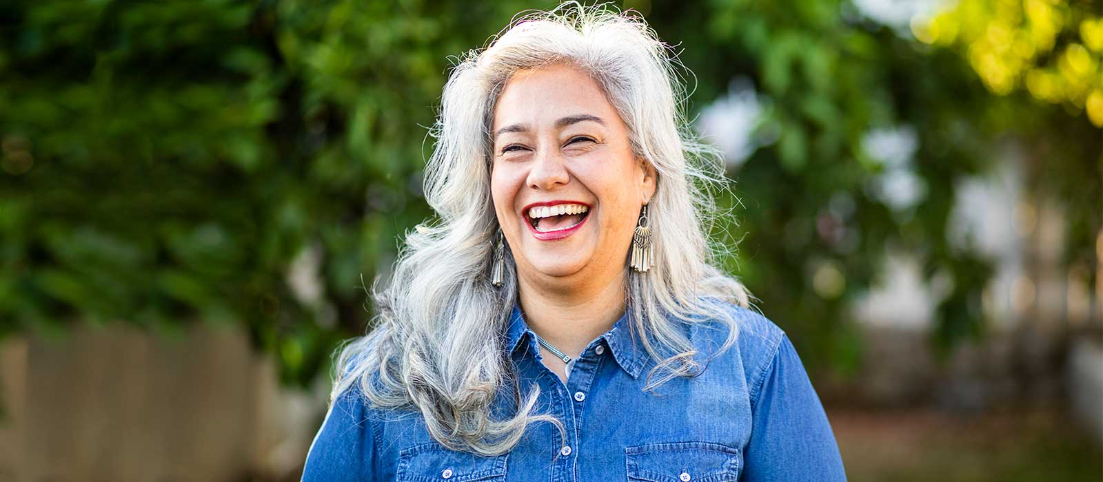 smiling confident woman with silver hair