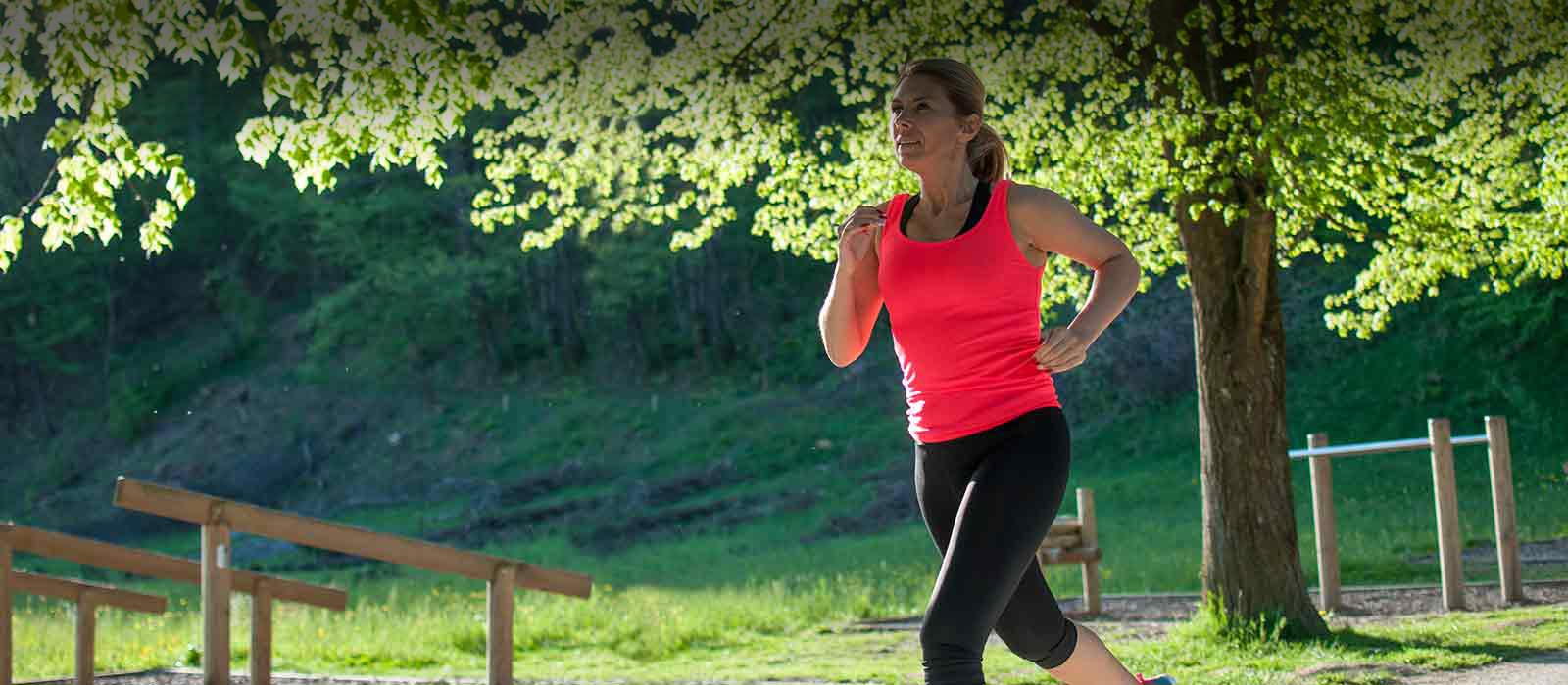 middle aged woman jogging outdoors