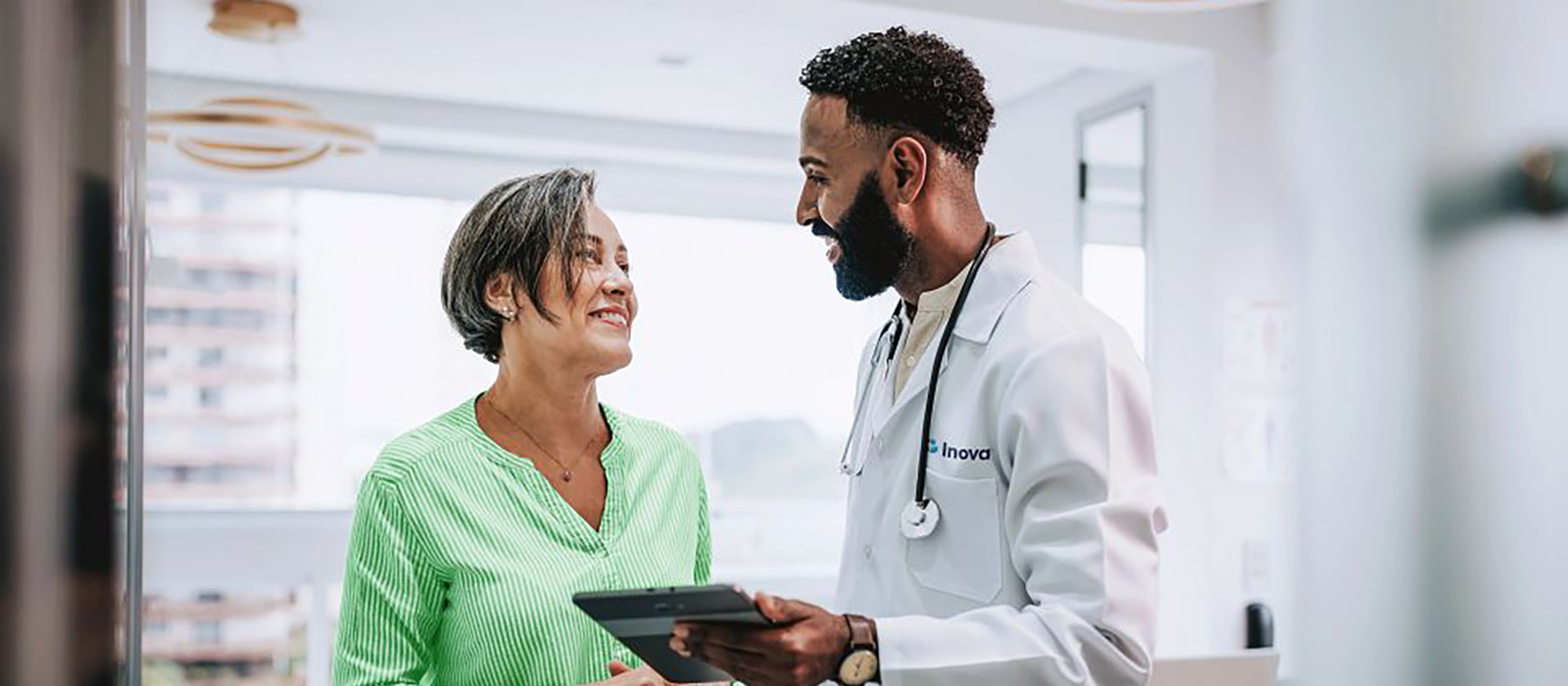 woman and male doctor speaking