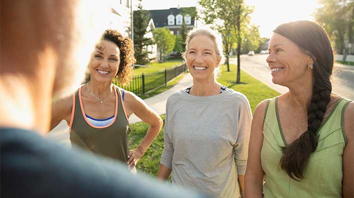 Female friends enjoying neighborhood fitness group