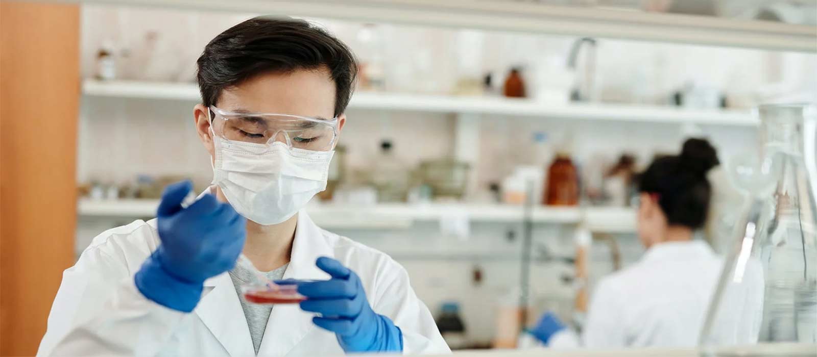 man doing a sample test in a laboratory