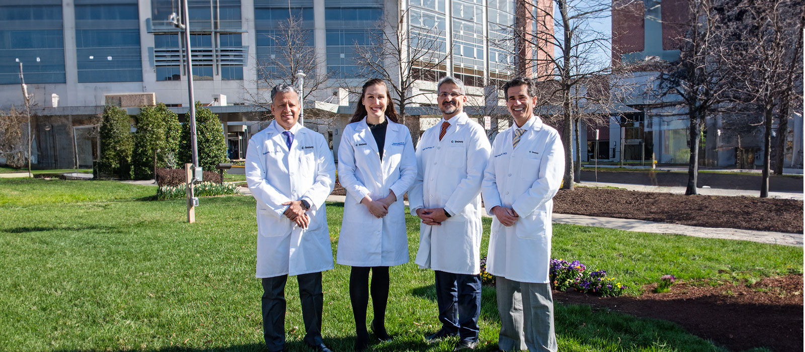 four doctors in front of hospital