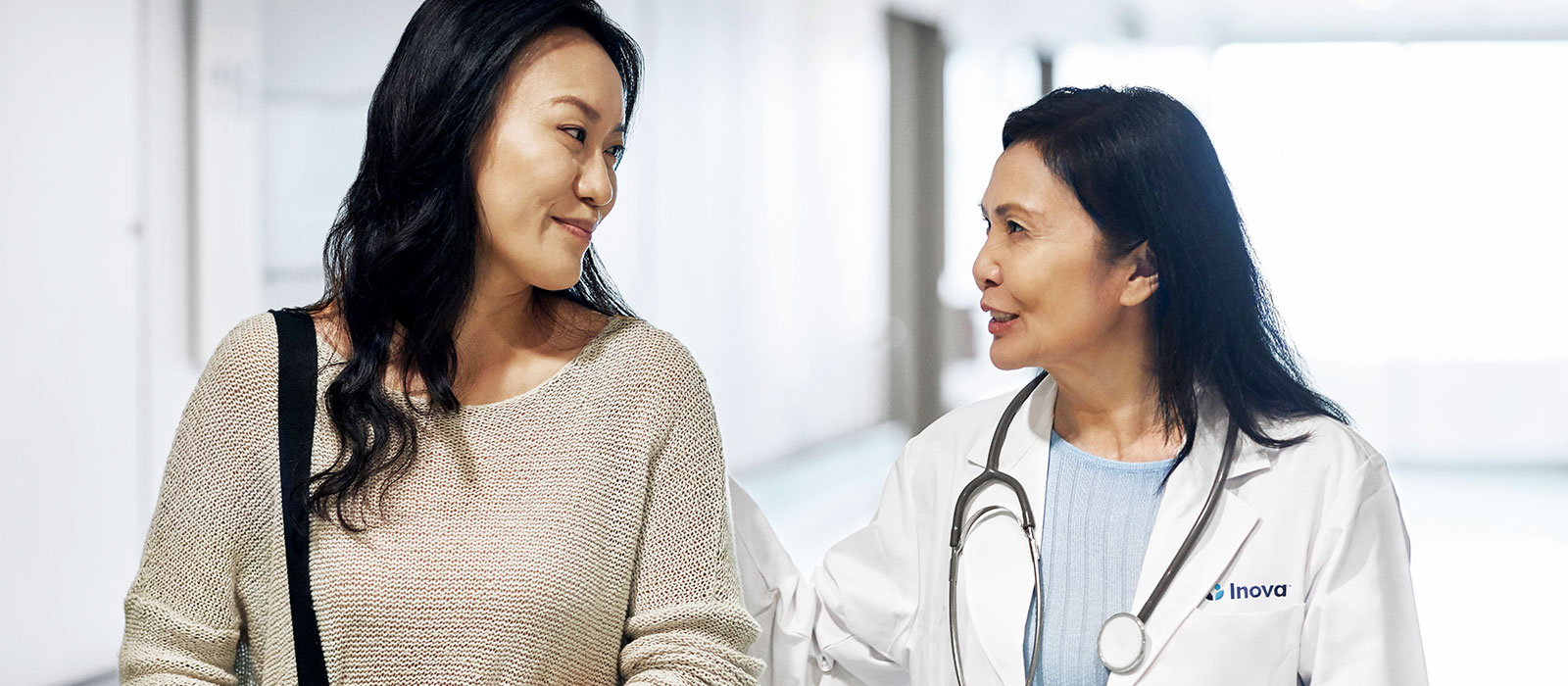 A female doctor with a woman