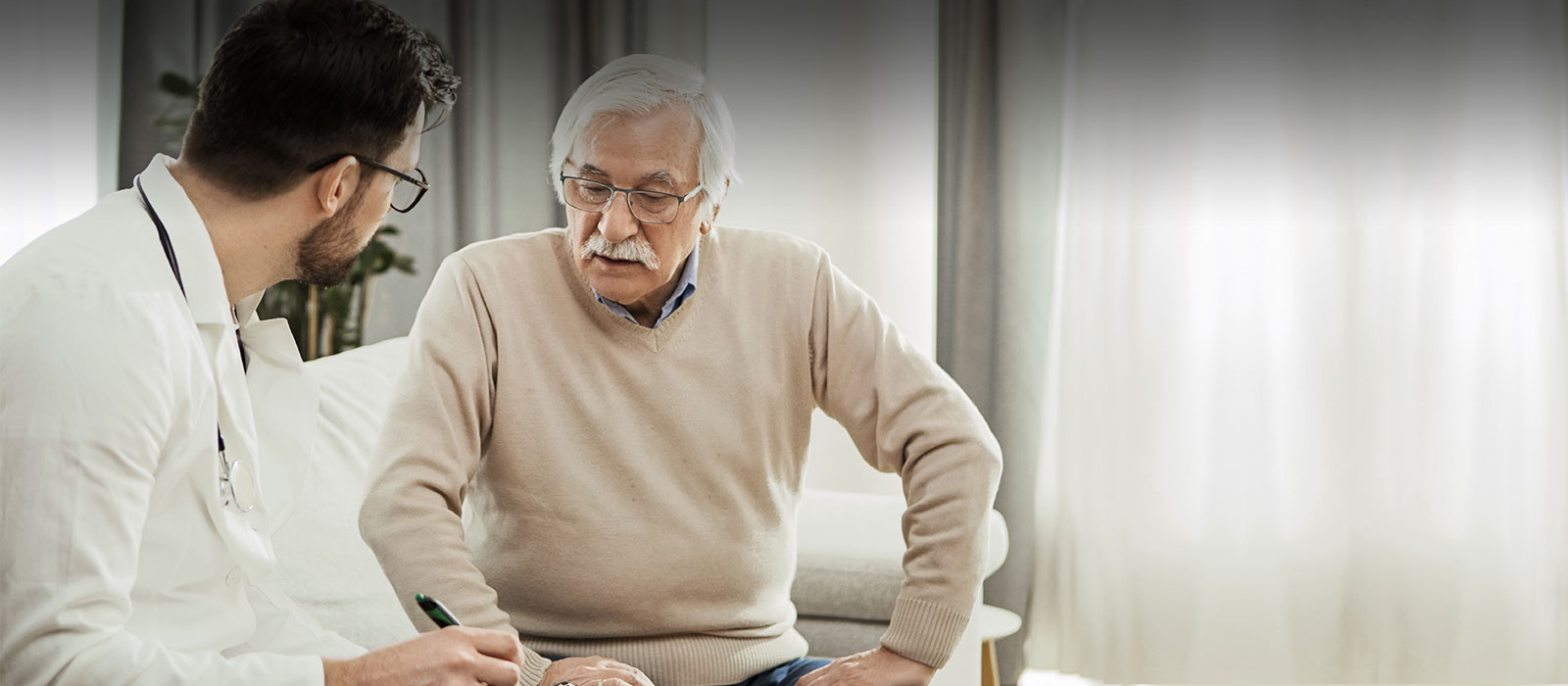 Senior patient with doctor