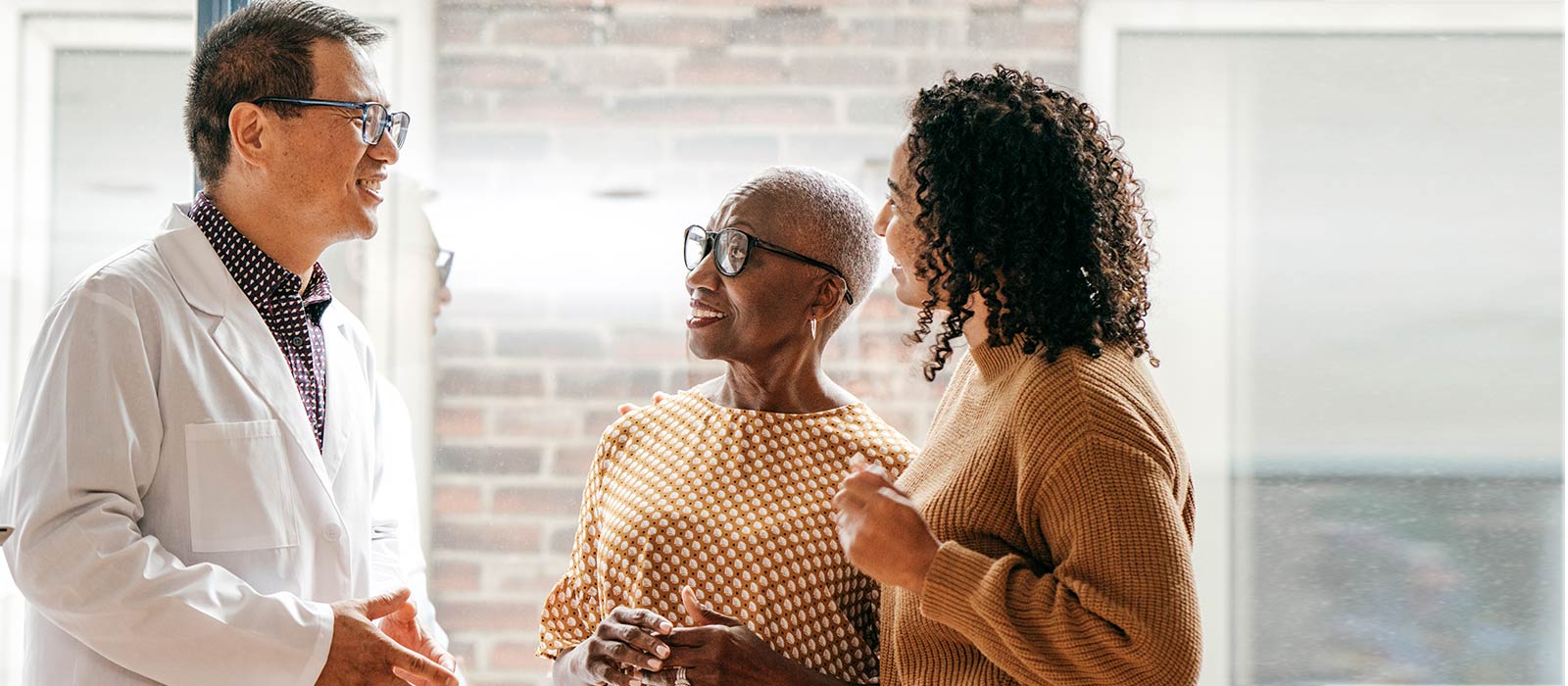 Doctor conversation with senior patient and adult daughter