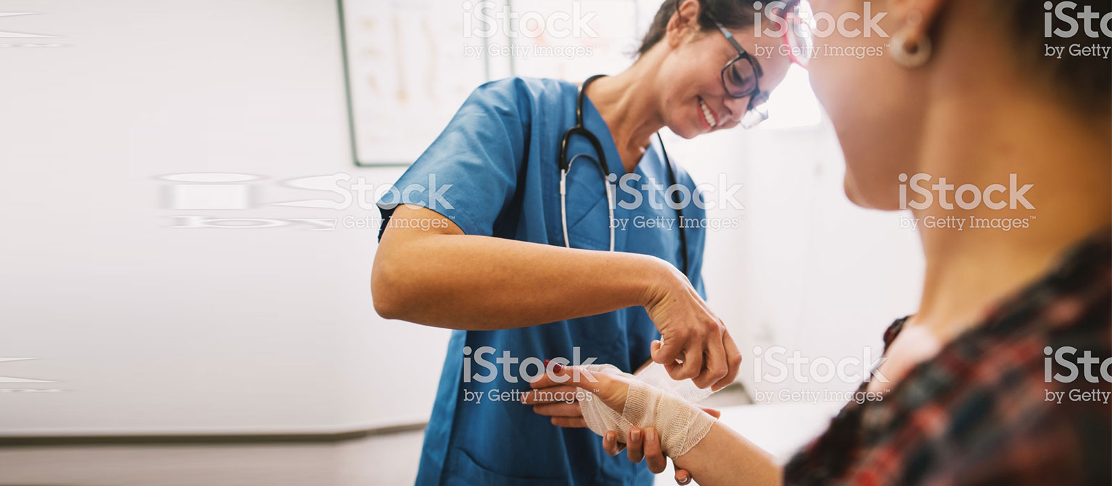 nurse applying aid to injured worker