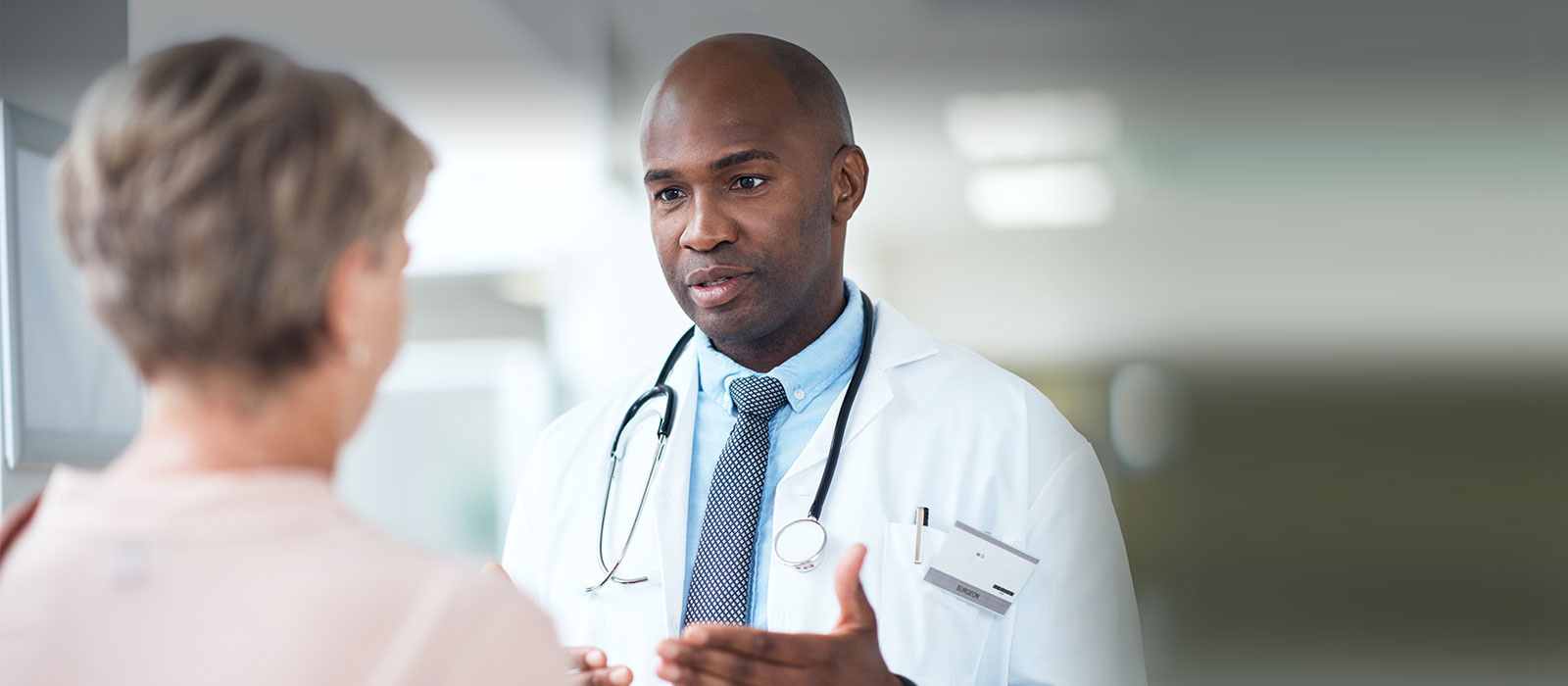 African American doctor consulting senior patient