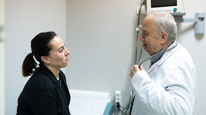 Doctor examining female patient 