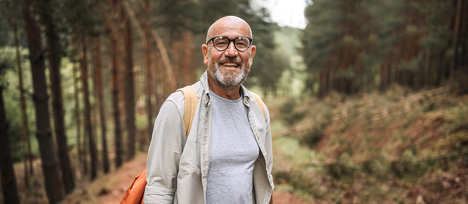 Mature man walking outdoor trails