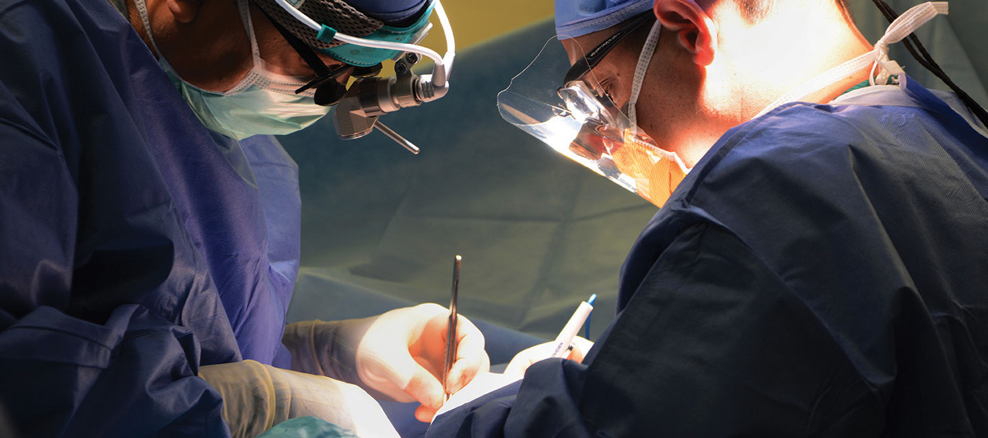 Two surgeons operating