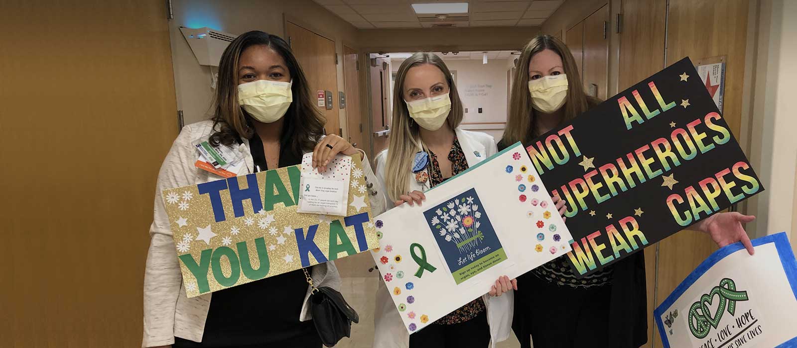 kidney team holding signs