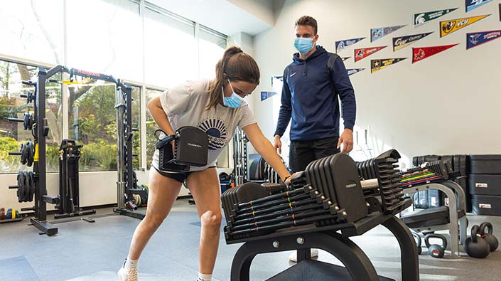 Female athlete with trainer