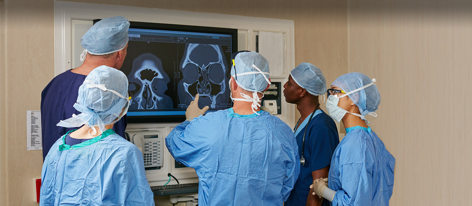 Neurosurgeons reviewing images