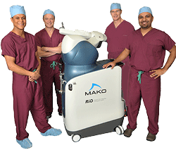 four surgeons with Makoplasty machine