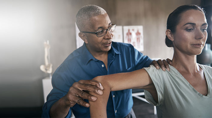 Woman rehabing shoulder 