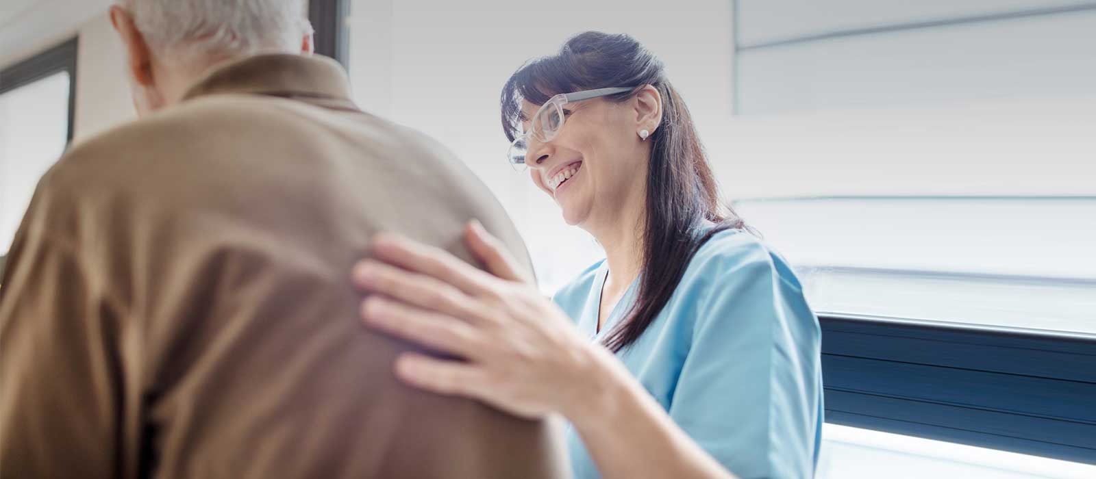 nurse assisting patient