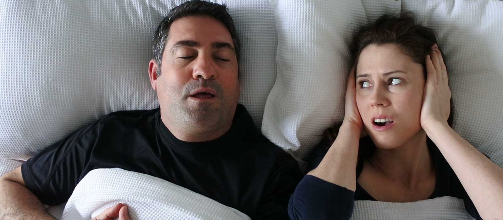 wife annoyed by husband's snoring