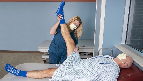 practitioner performing a straight-leg test