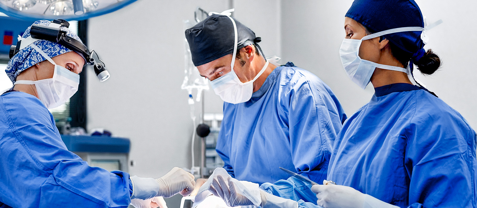 Close up of surgeons in operating room