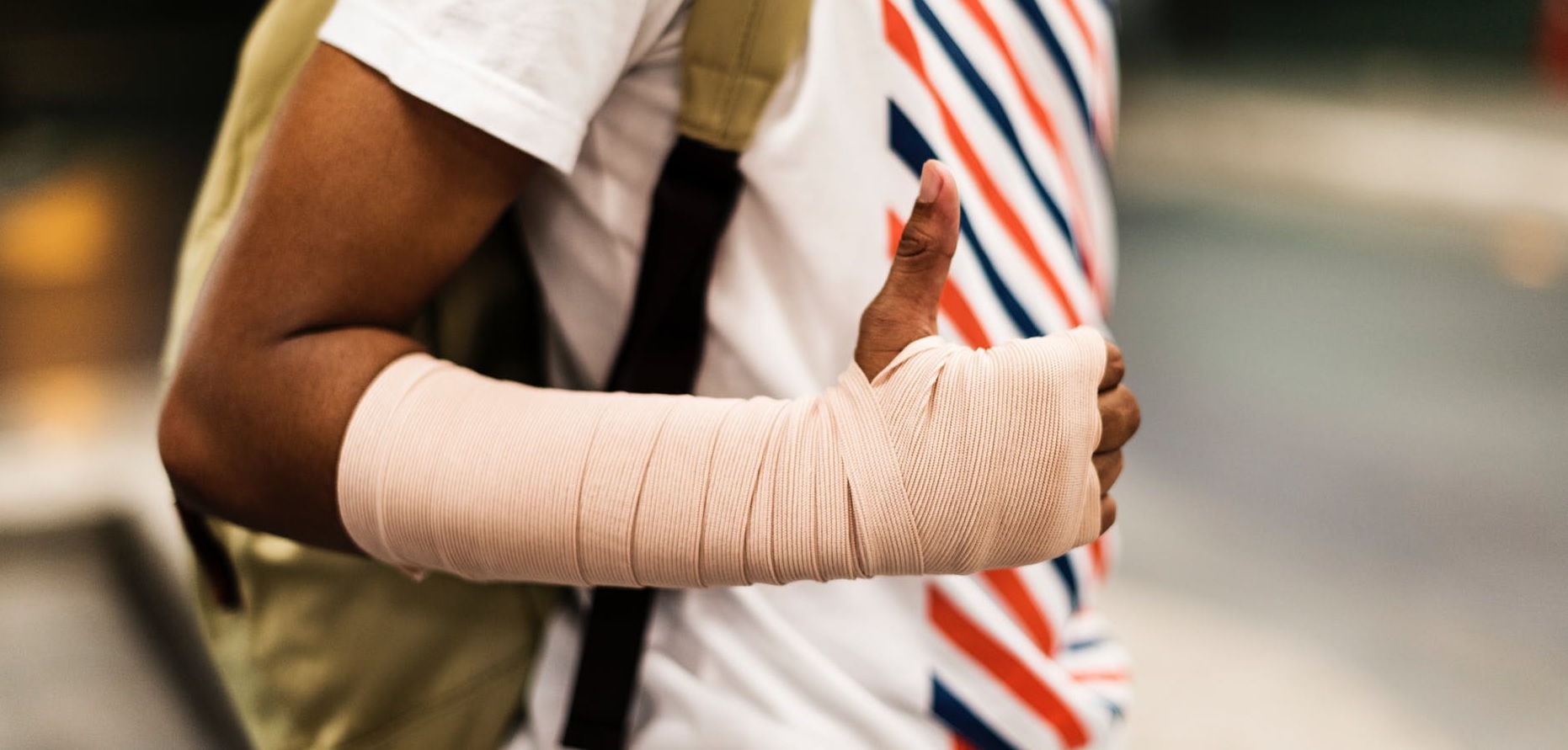 closeup of young person with arm in bandage