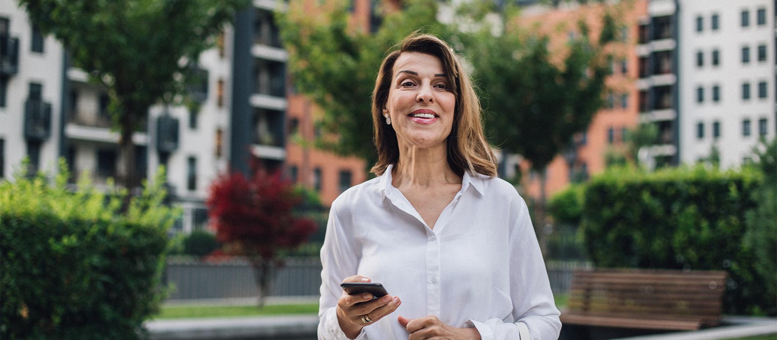 middle aged woman walking to office