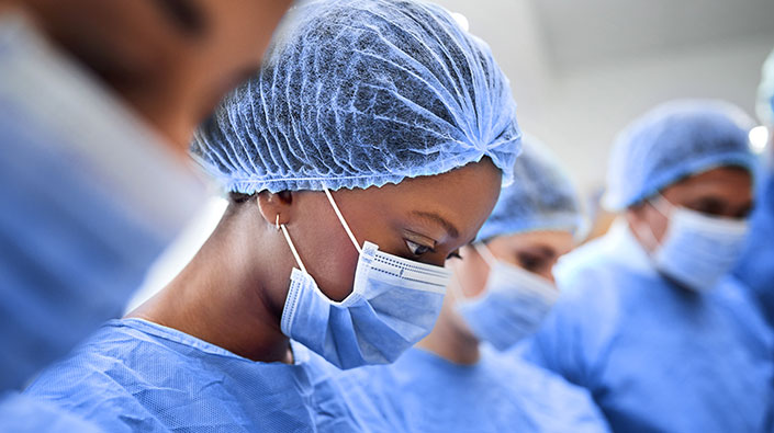 Female doctor performing surgery