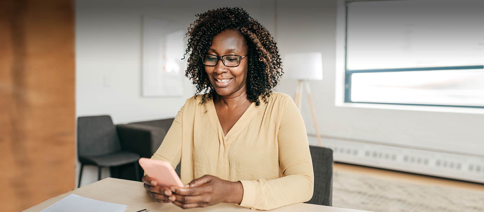 Mature woman using her smartphone.