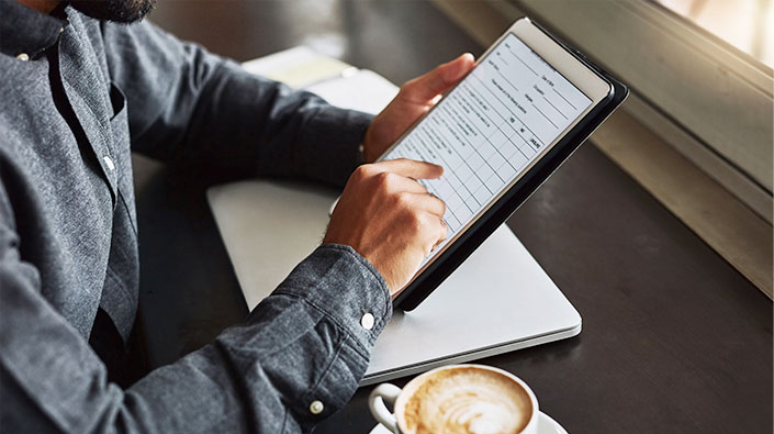 Close up of man using tablet