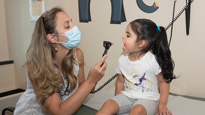 doctor examining peds patient