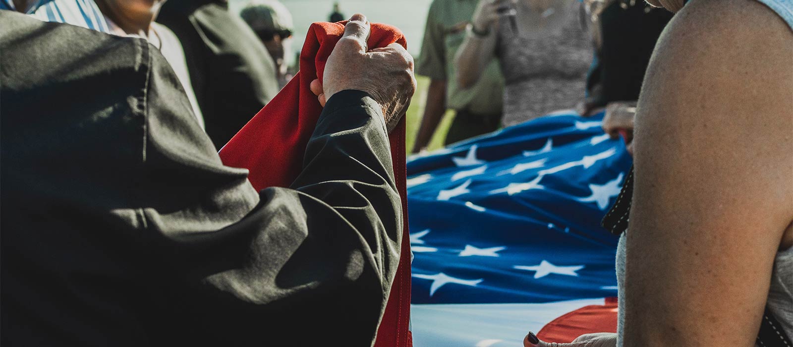 Veterans folding American flag