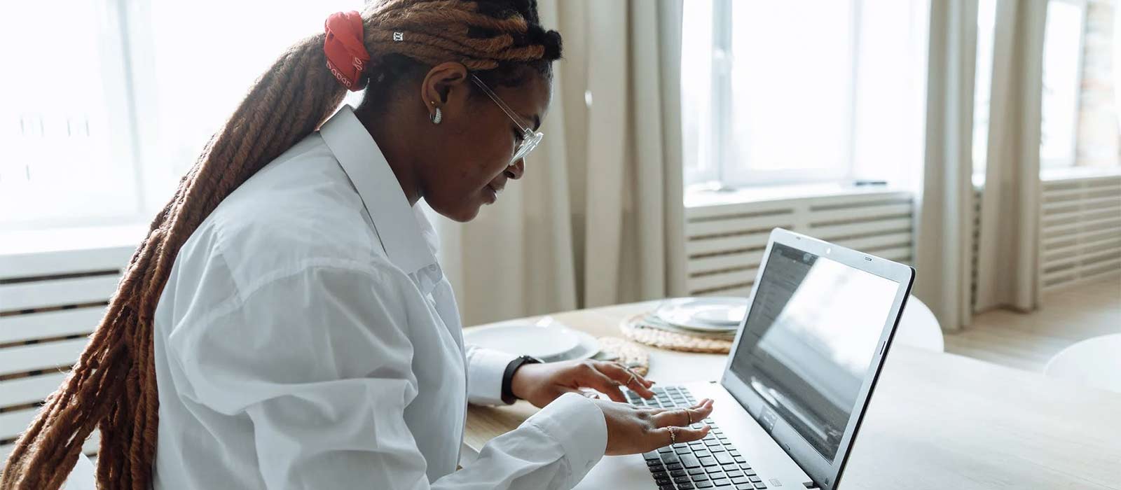 woman typing on a laptop