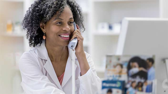 smiling doctor on phone