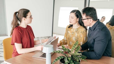 Asian couple consulting with genetic counselor