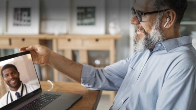 patient speaks with doctor via computer