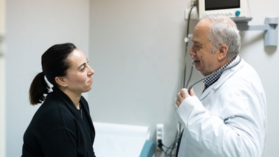 Doctor examining female patient 