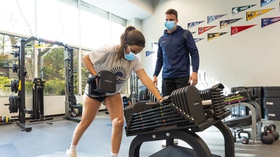Female athlete with trainer