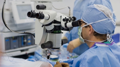 Surgeon performing micro surgery