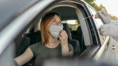 Woman getting drive by covid test