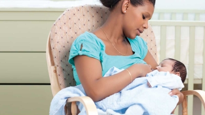 mother breastfeeding her child