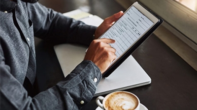 Close up of man using tablet