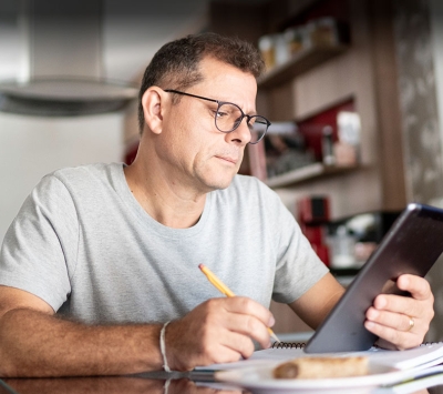 Middle aged man using laptop