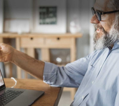 Mature man using telemedicine app with specialist
