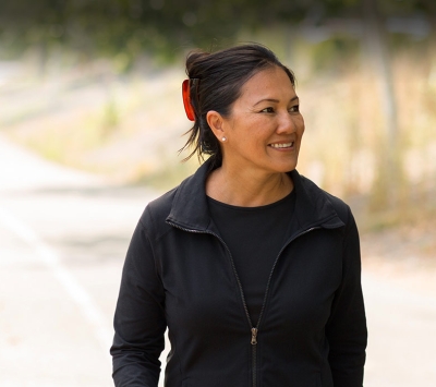 Mature Asian woman walking outdoors