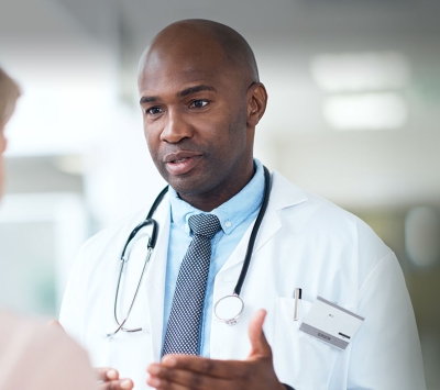 African American doctor consulting senior patient
