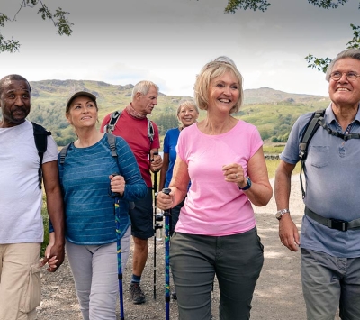 Group of senior couples walking on trail