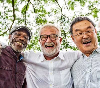 Diverse senior friends laughing outdoors
