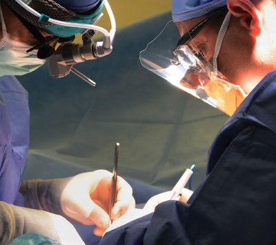 Two surgeons operating