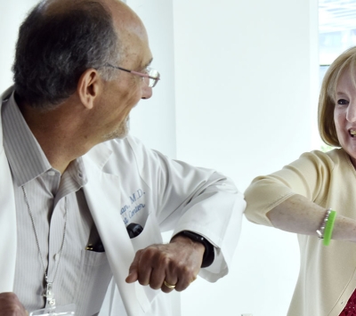 Doctor and patient elbow shake
