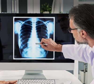 Doctor and patient reviewing x-ray image