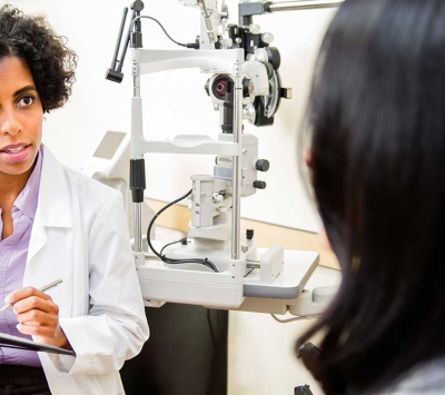 female optometrist and patient